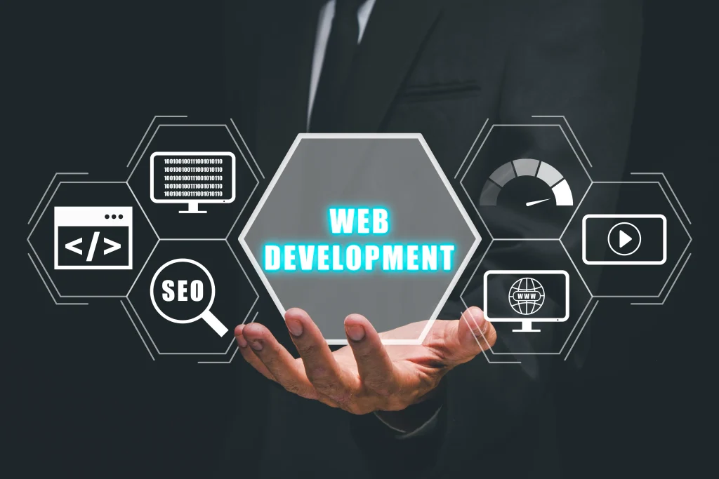 A person in a suit holds a glowing hexagon labeled "Web Development." Surrounding icons depict coding, SEO, graphical speed, and multimedia elements Mint Digital Solutions