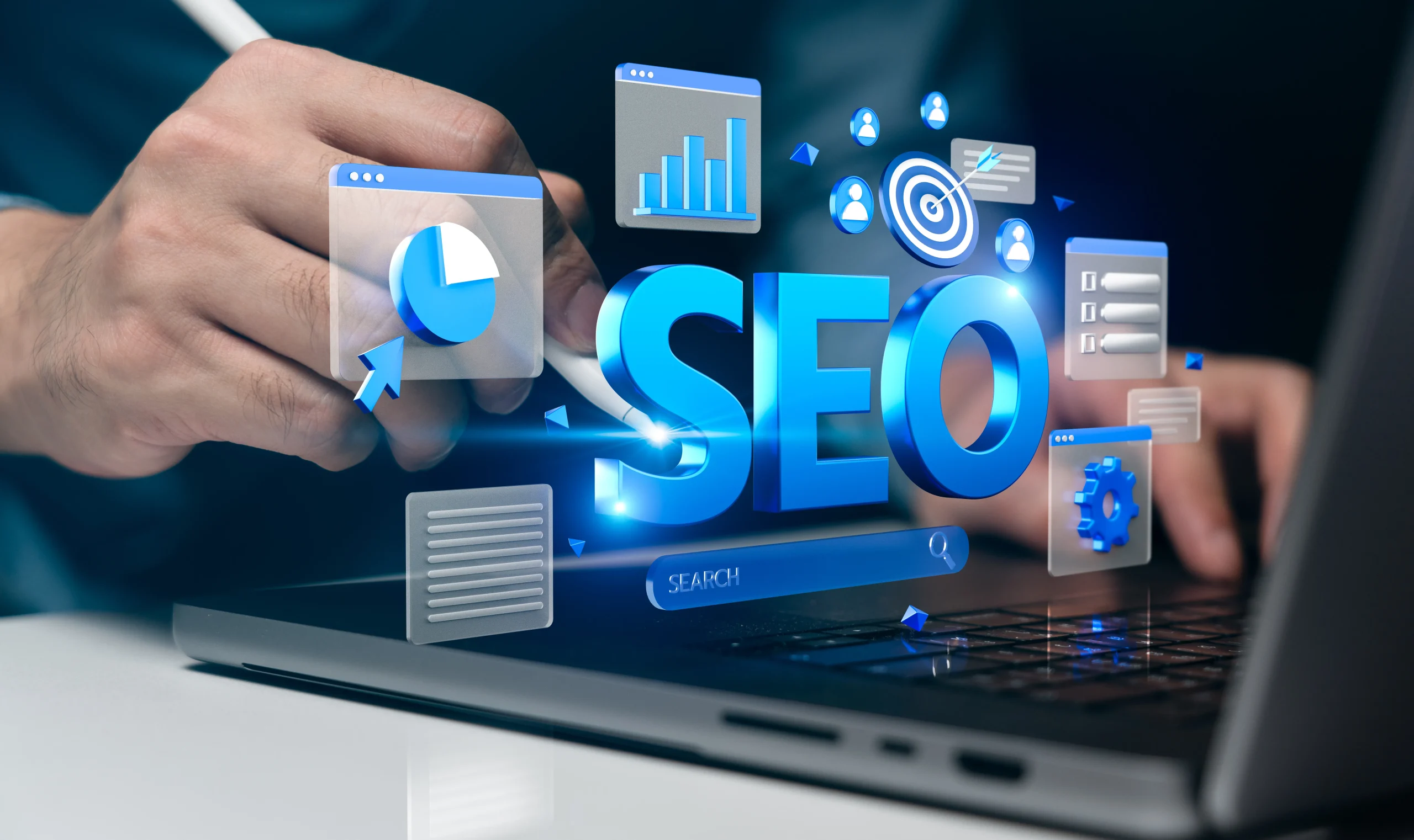 A person uses a pen on a laptop displaying digital charts, graphs, and "SEO" in bold blue. The image conveys a focus on search engine optimization. mintdigitalsolutions