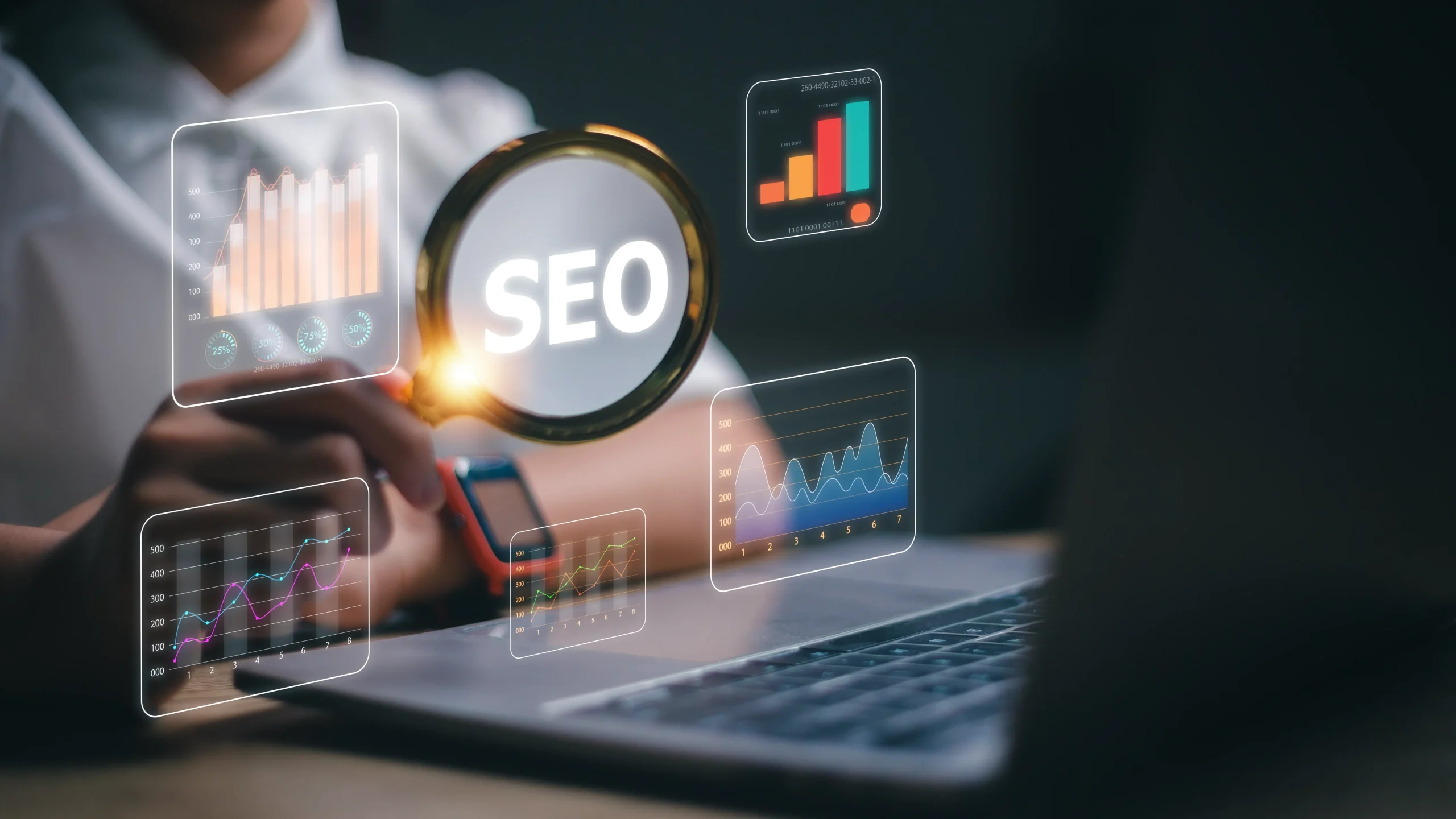 A person holds a magnifying glass over the word "SEO," surrounded by floating digital graphs and charts, with a laptop in the background, implying data analysis. mintdigitalsolutions